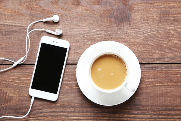 Cup of coffee and smarphone — Stock Photo, Image