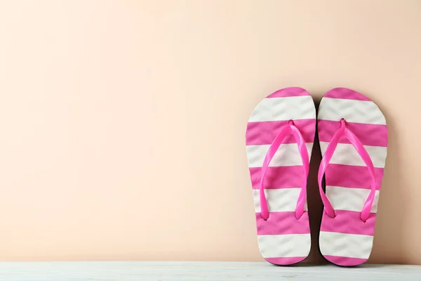 Pair of flip flops on  table — Stock Photo, Image