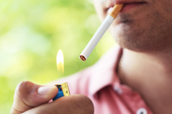 Man  lighting up cigarette