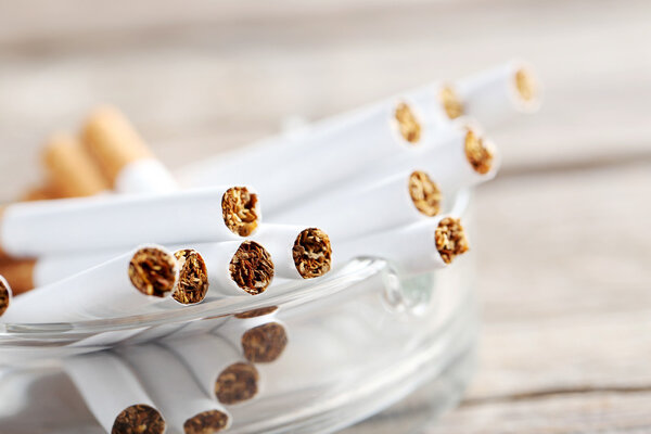 Tobacco cigarettes on  table