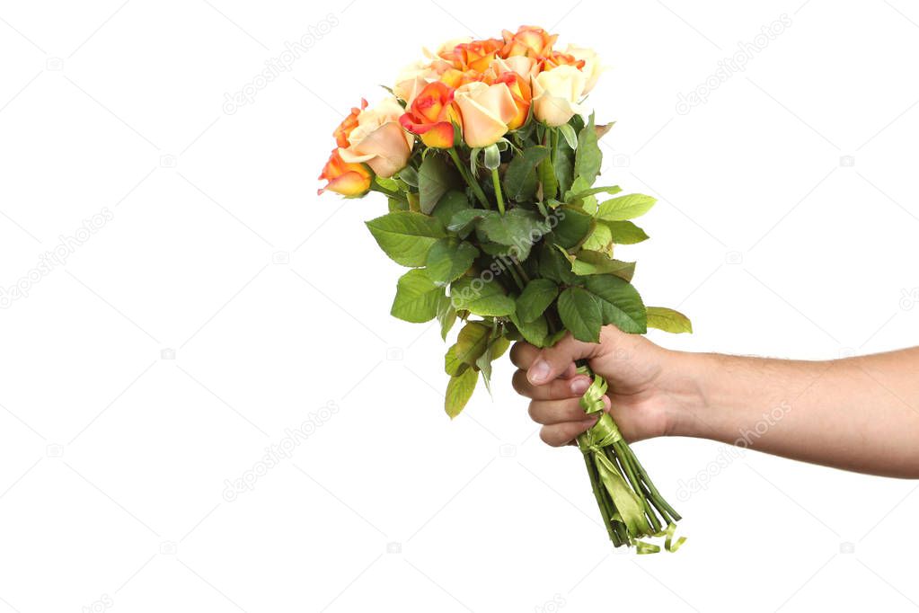 hand holding bouquet of orange roses