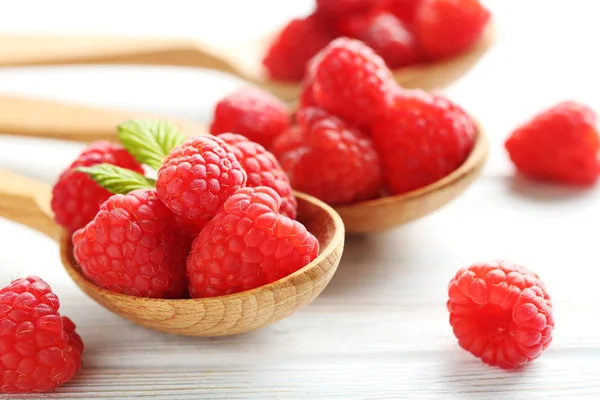 Red raspberries in spoons — Stock Photo, Image