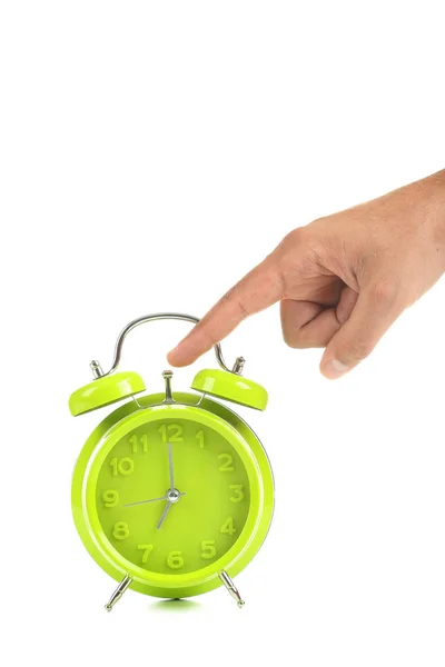 Green alarm clock with male hand — Stock Photo, Image