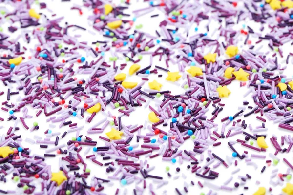 Colorful sprinkles on  white — Stock Photo, Image