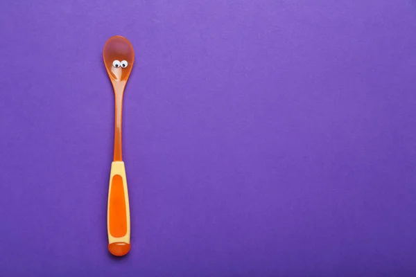 Plastic spoon with googly eyes — Stock Photo, Image