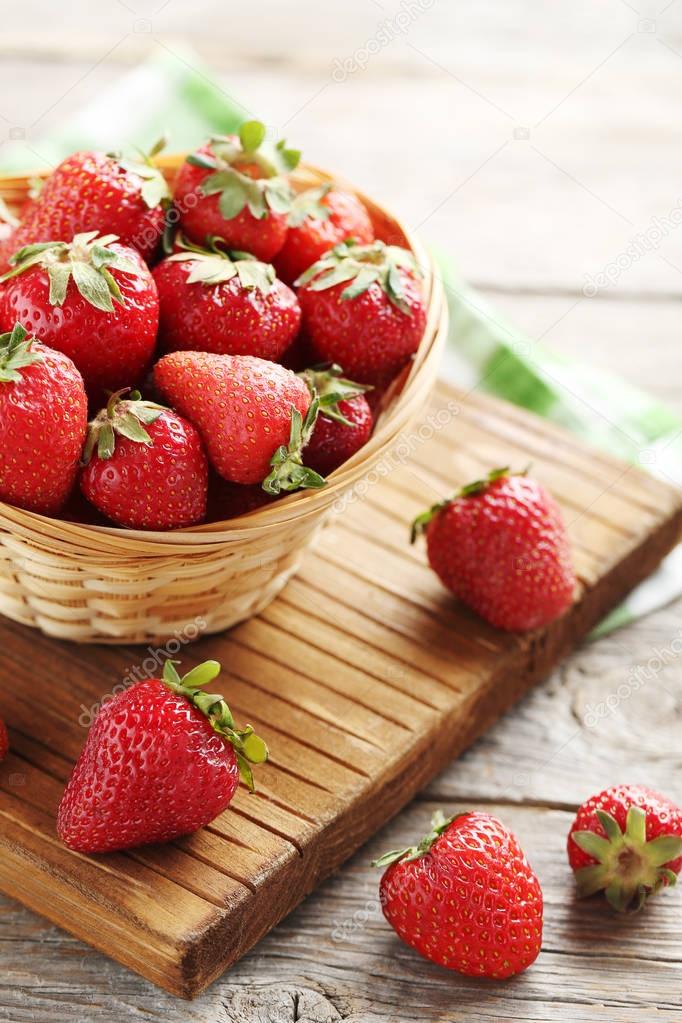 Fresh and tasty strawberries in basket 