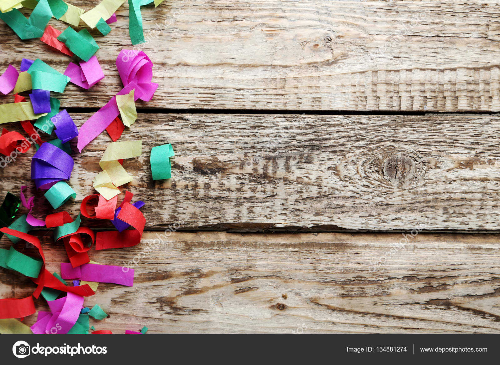 Colored confetti on wooden table — Stock Photo © 5seconds 134881274
