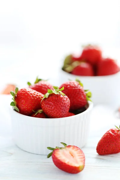 Fresh strawberries in bowls — Stock Photo, Image