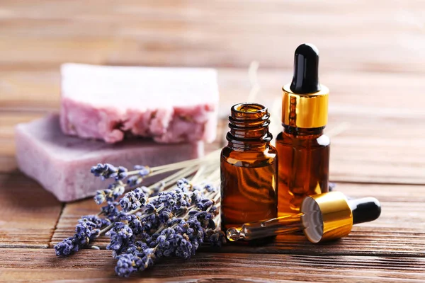 Lavender oil with soap and flowers — Stock Photo, Image