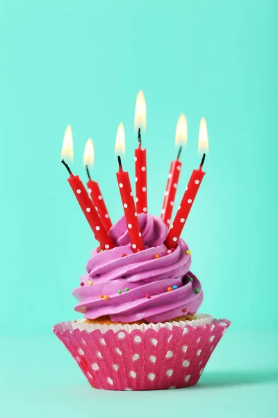 Tasty cupcake with candles — Stock Photo, Image