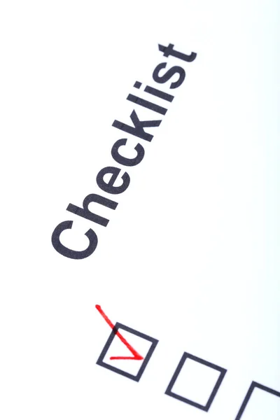 Checklist con caselle di controllo su carta bianca — Foto Stock