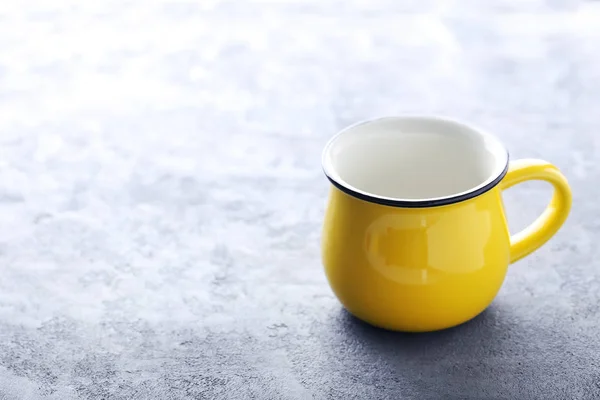 Yellow mug on table