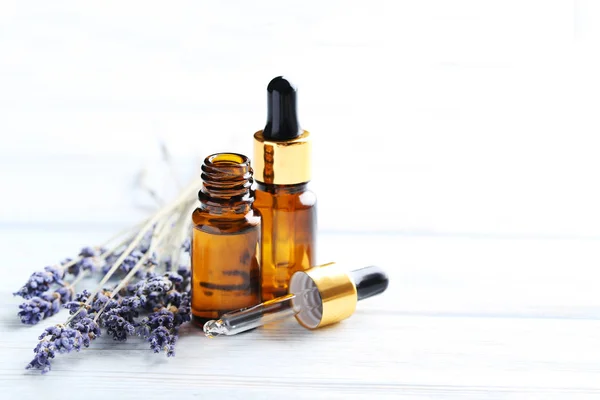 Lavender oil and flowers — Stock Photo, Image