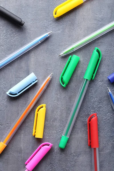 Colored pens on grey wooden table — Stock Photo, Image