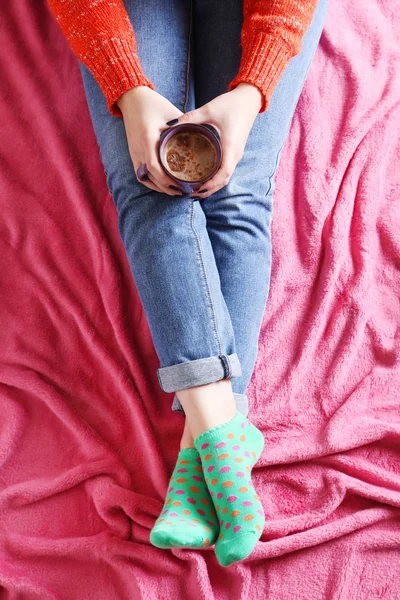 Woman sitting with cup of coffee — Stock Photo, Image