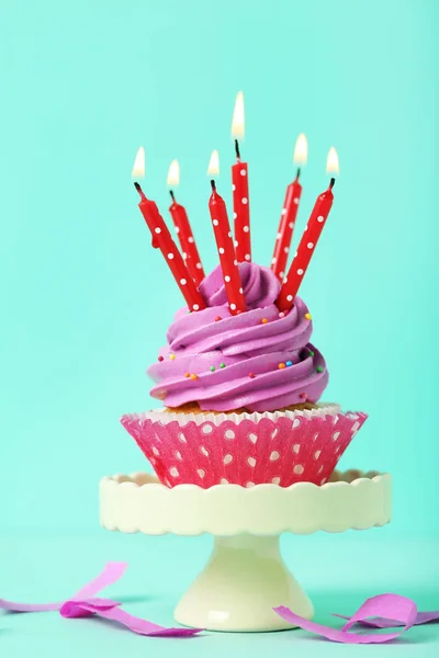 Tasty cupcake with candles — Stock Photo, Image