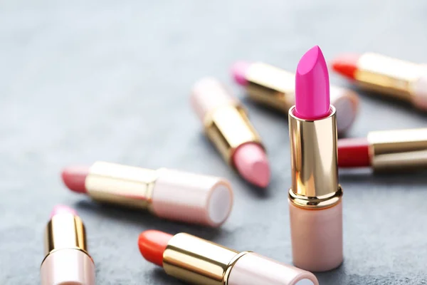 Lipsticks on wooden table — Stock Photo, Image