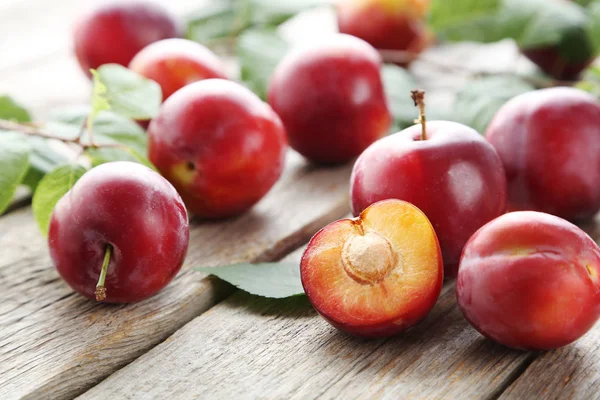 Fresh plums on table — Stock Photo, Image