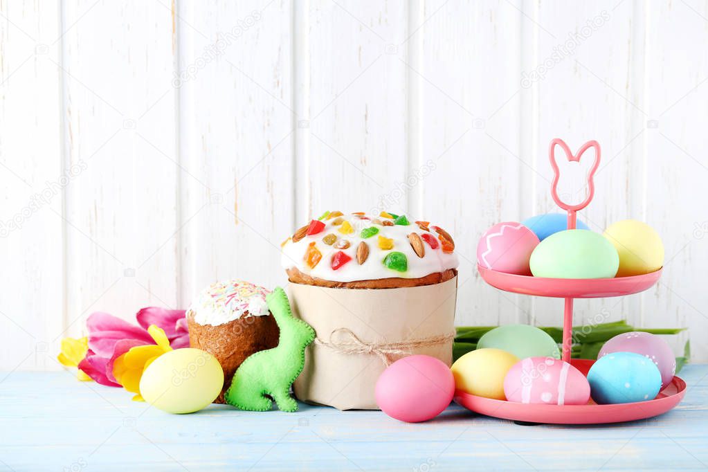 Easter eggs with cake and tulips 