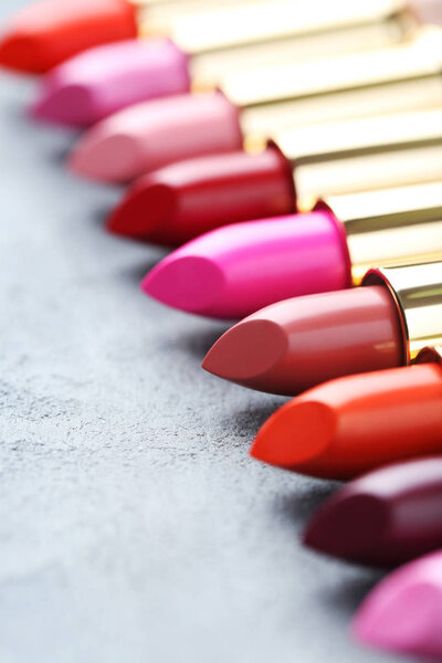 Colorful lipsticks on table