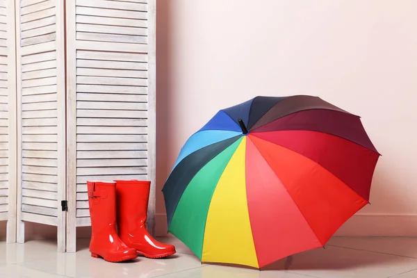 Red boots with umbrella — Stock Photo, Image