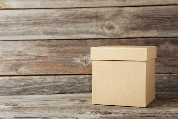 Brown box on a grey — Stock Photo, Image