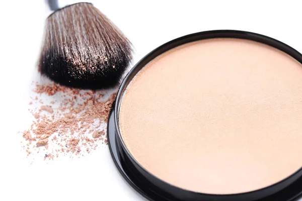 Makeup powder and brush Stock Photo
