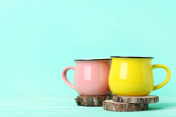 Pink and yellow mugs