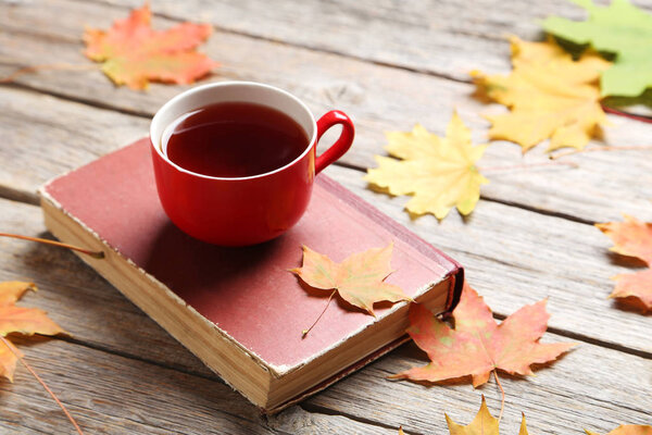 Autumn leaves with cup of tea 