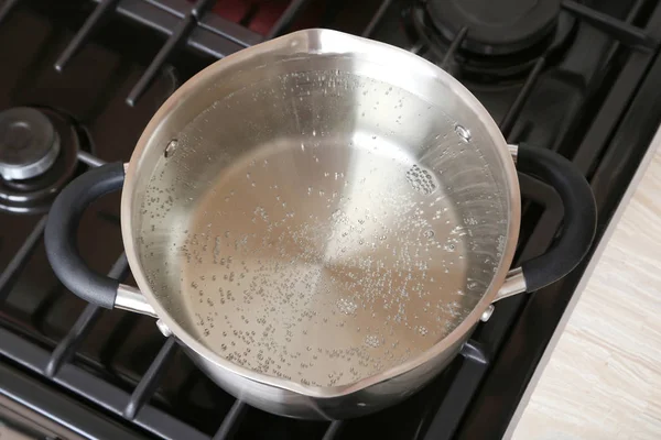 Water boiling into saucepan — Stock Photo, Image