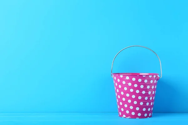 Pink bucket with white dots — Stock Photo, Image