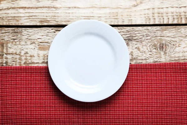 Empty plate with napkin — Stock Photo, Image