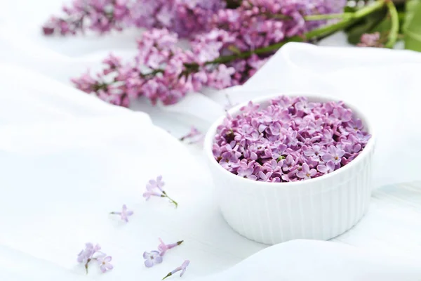 Lilac flowers in bowl