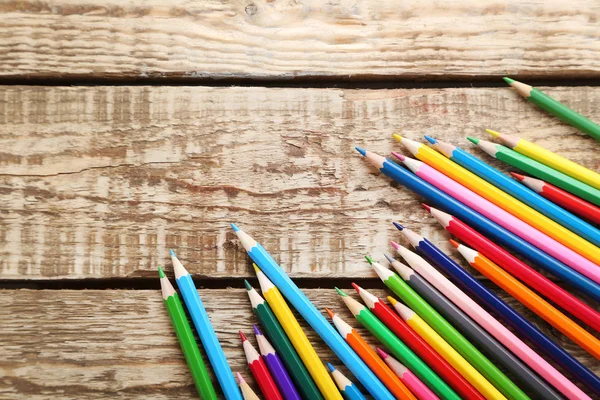 Colorful pencils on wooden table — Stock Photo, Image