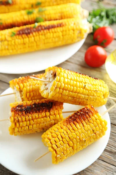 Tasty grilled corn on wooden table — Stock Photo, Image