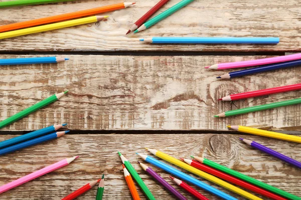 Colorful pencils on wooden table — Stock Photo, Image