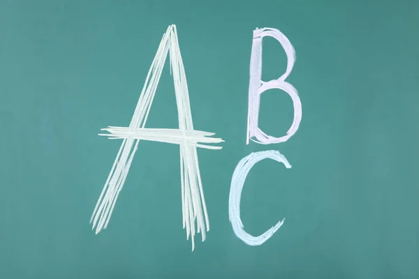 Handwritten letters on blackboard — Stock Photo, Image