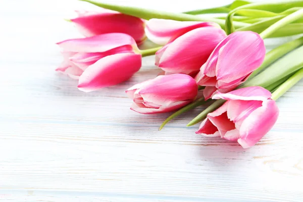 Pink tulip flowers on tabletop — Stock Photo, Image