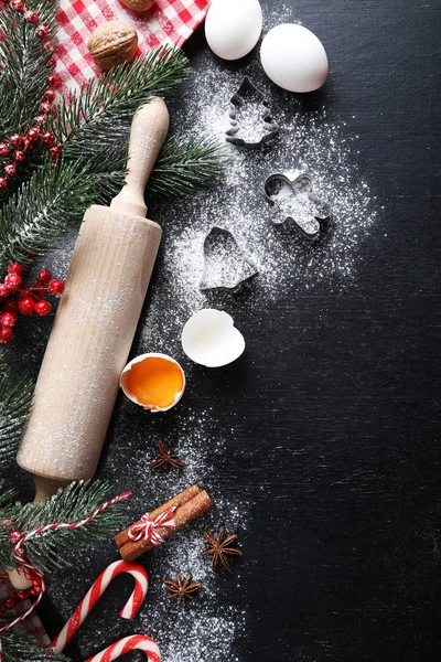 Christmas tree branches with cinnamon, eggs, flour and anise star — Stock Photo, Image