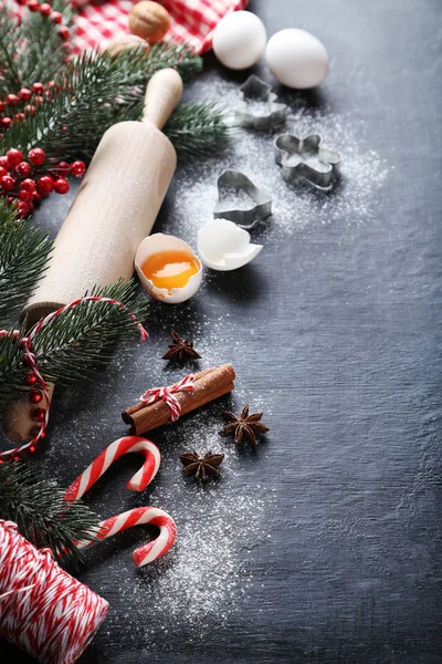 Christmas tree branches with cinnamon, eggs, flour and anise star — Stock Photo, Image
