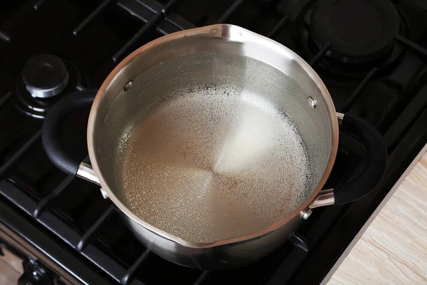 Water boiling into saucepan — Stock Photo, Image