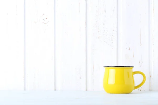 Yellow empty mug