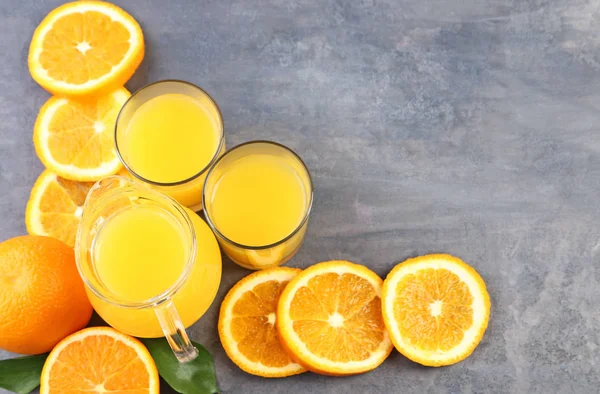 Glass jug with orange juice — Stock Photo, Image