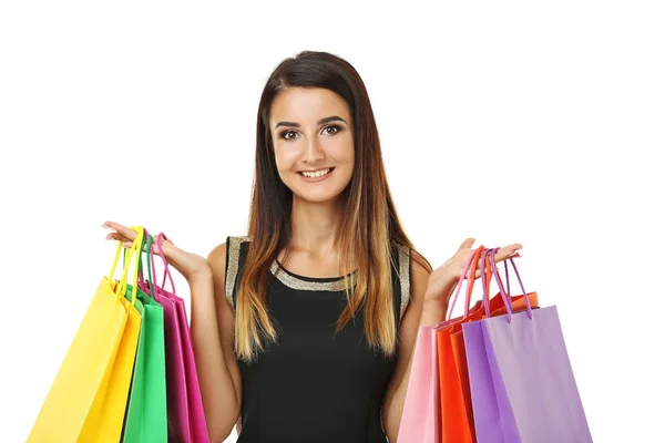 Retrato de mujer joven con bolsas de compras sobre fondo blanco — Foto de Stock