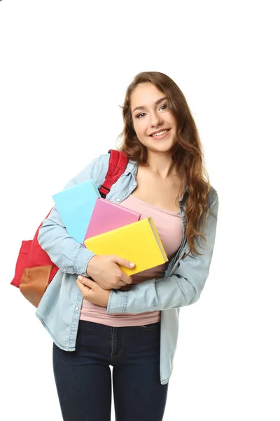 Πορτρέτο του κορίτσι φοιτητής με σακίδιο και βιβλία σχετικά με λευκό έκφραση — Φωτογραφία Αρχείου