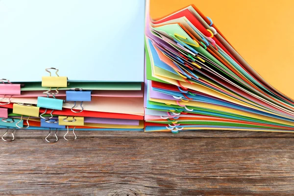 Stack of colored papers with paperclips — Stock Photo, Image