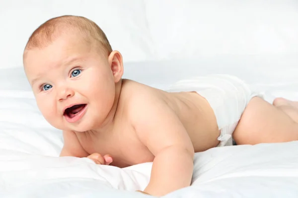 Little newborn baby on white bed — Stock Photo, Image