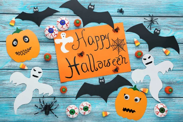 Halloween bats, spiders, ghosts and candies — Stock Photo, Image