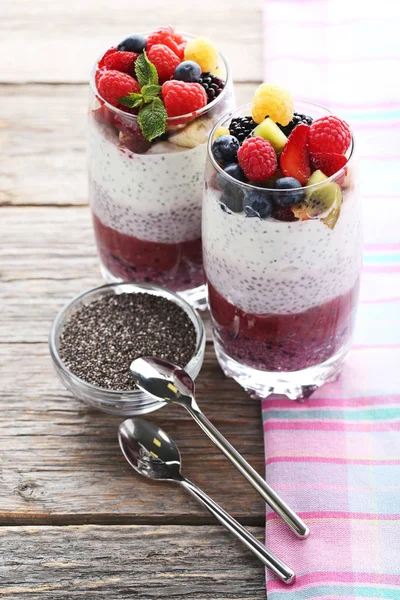 Chia puddings with berries in glasses — Stock Photo, Image