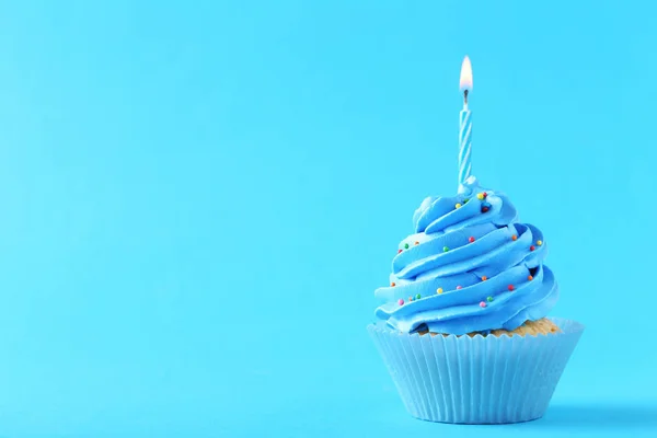 Tasty cupcake with candle — Stock Photo, Image